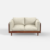 Sofa with wooden frame and beige cushions on a white background
