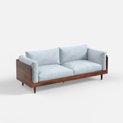 Sofa with wooden frame and light blue cushions on a white background