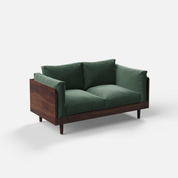 Green sofa with wooden frame on a white background