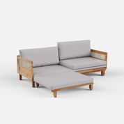 Wooden sofa bed with rattan sides, gray cushions on a white background